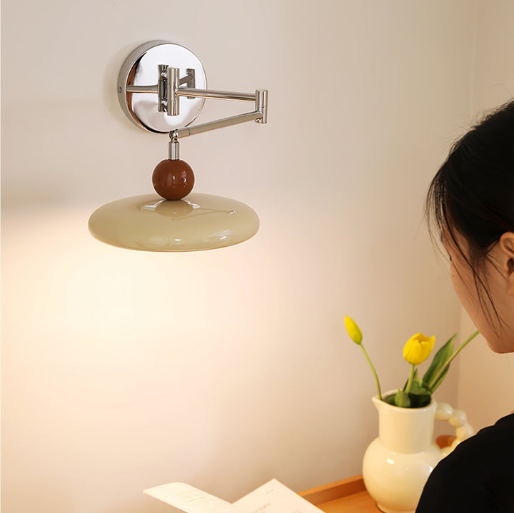 "Modern swing arm wall lamp with adjustable metal arm, acrylic base, integrated LED, beige and green color options."