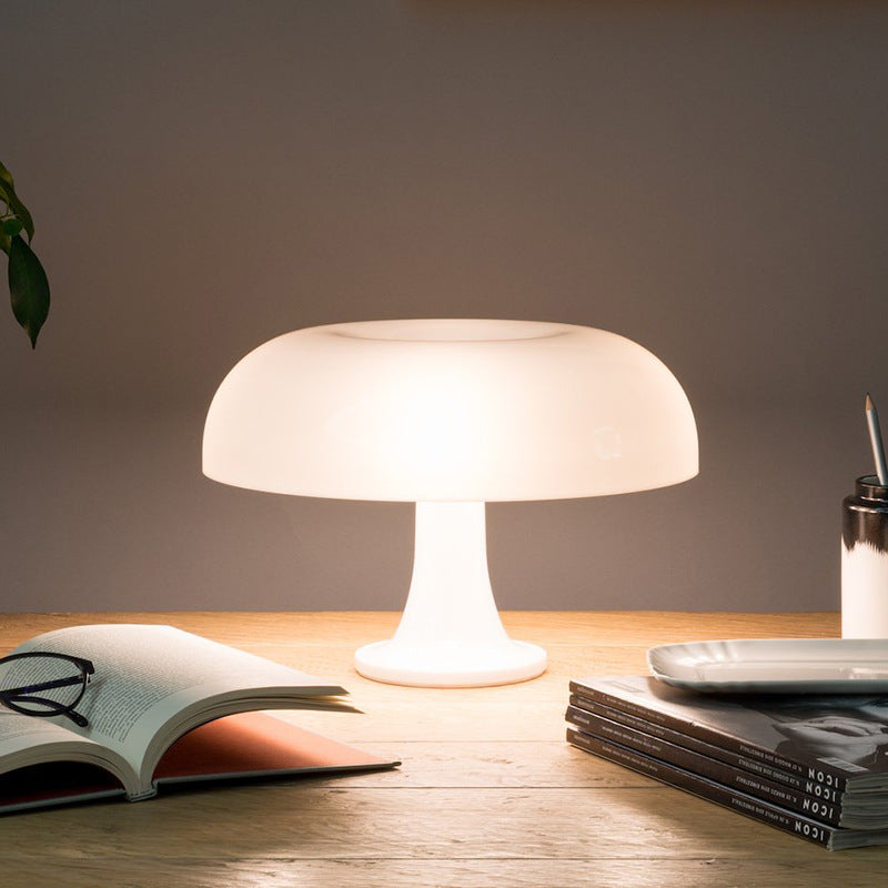 "Mushroom-shaped minimalist table lamp with LED, Nordic design, in white and orange; perfect for modern interiors."