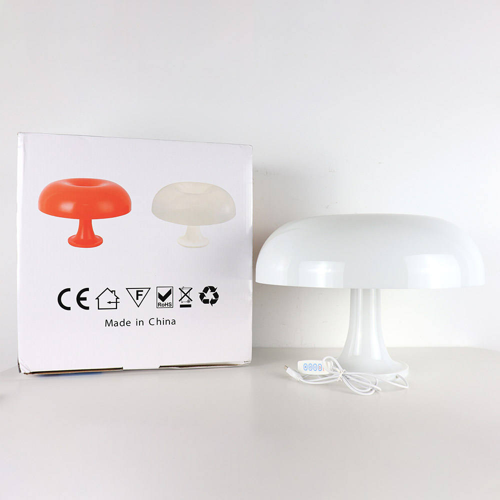 "Mushroom-shaped minimalist table lamp with LED, Nordic design, in white and orange; perfect for modern interiors."