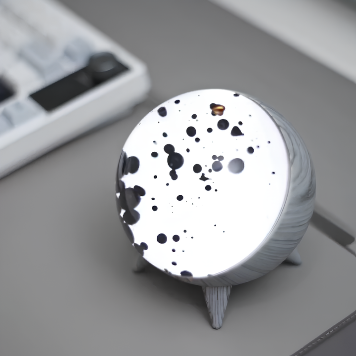 "Music-reactive ferrofluid display with black fluid art in motion, Bluetooth connectivity, and built-in lighting for tech lov