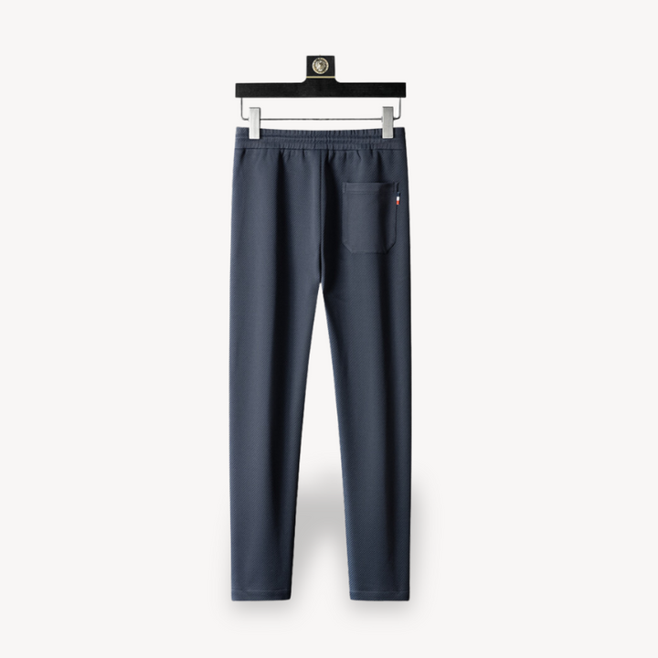 "Navy and black men's tracksuit set with zip jacket and joggers, showcasing sleek design and comfort for casual or gym wear."