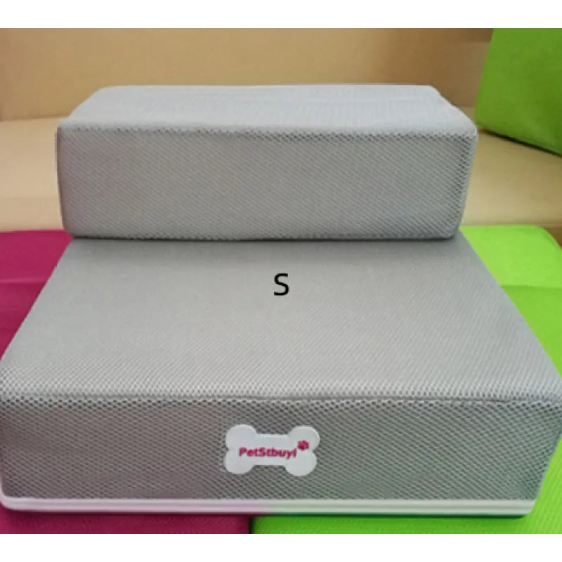 "Non-slip pet stairs with soft foam for dogs and cats, safe steps for easy access to sofa or bed, supportive and stylish."