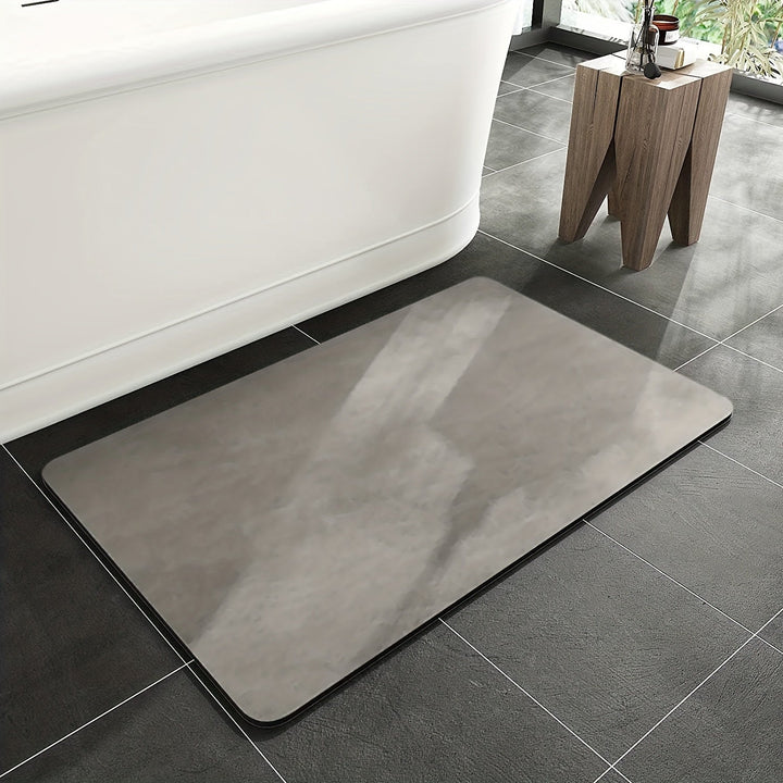 Non-slip quick-dry diatomaceous earth bath mat, ideal for bathroom safety and comfort after shower. Super absorbent.