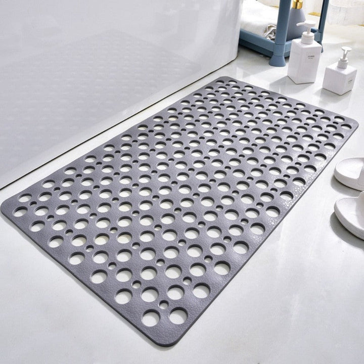 Non-slip shower mat with suction cups, textured for comfort, mold-resistant, in blue, green, grey; enhances bathroom safety.