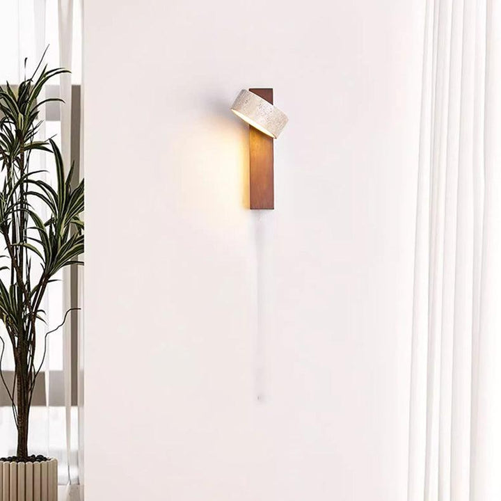 "Off-white travertine wall lamp with LED light, minimalist design, wood accents, ideal for ambient bedroom lighting."