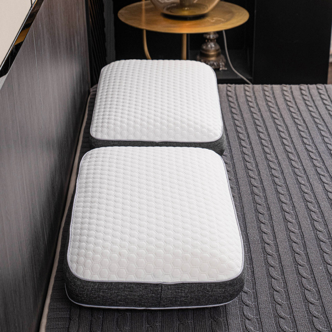 Orthopedic memory foam pillow offering pain-free sleep with ergonomic design and breathable cover for all sleep positions.