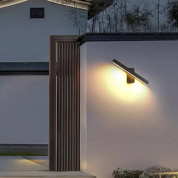 "Outdoor PIR motion sensor wall light, black aluminium, IP65 waterproof, rotatable design, warm white glow, modern style."