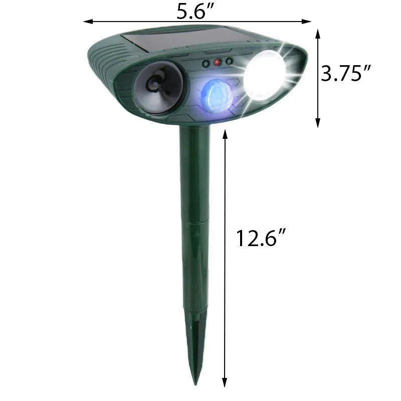 "Outdoor solar-powered ultrasonic deer repeller in garden setting, showcasing green and grey weather-resistant design."
