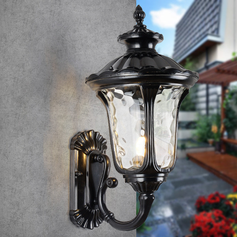 "Outdoor waterproof bronze wall light with clear water glass shade, elegant design for stylish exterior lighting."