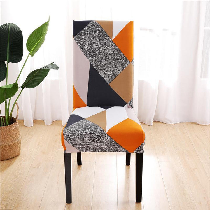 Patterned prismatic chair cover enhancing elegance; high-elasticity, anti-slip, durable fabric for stylish home décor.