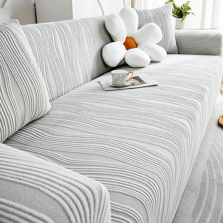 Pet-friendly jacquard stretch sofa cover in stylish design, protects against scratches and complements any decor.