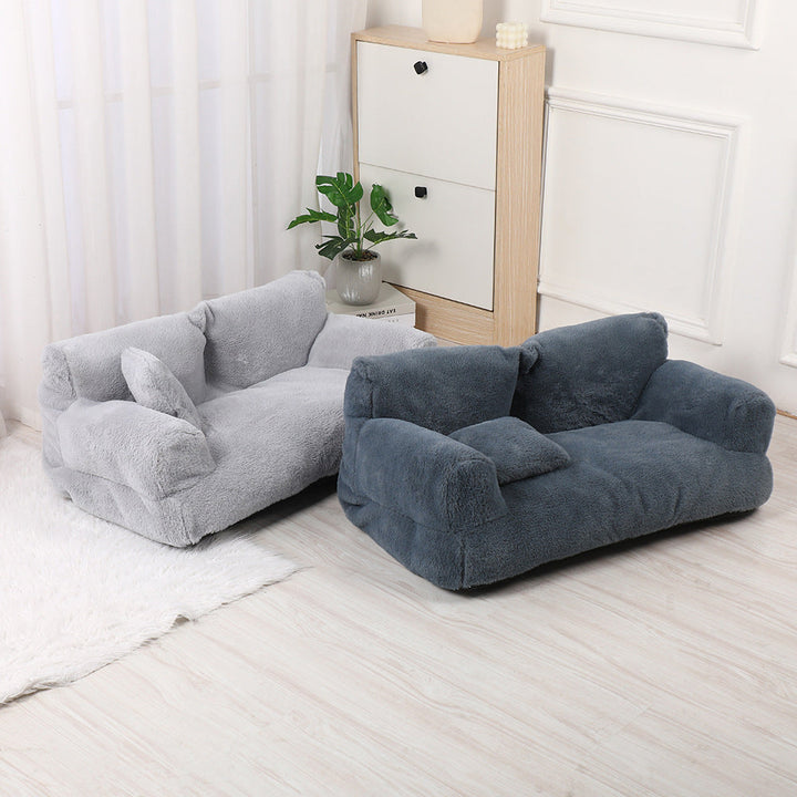 "Plush dog sofa bed in beige, features raised edges for security, soft cushioning for comfort, available in versatile sizes."