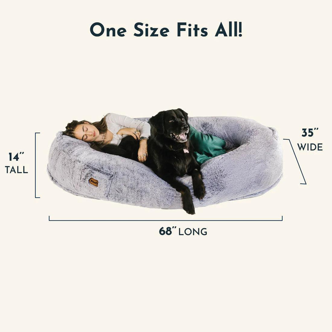 "Plush oversized lounger for pets and owners, featuring gray memory foam and plush bolsters for ultimate comfort and style."