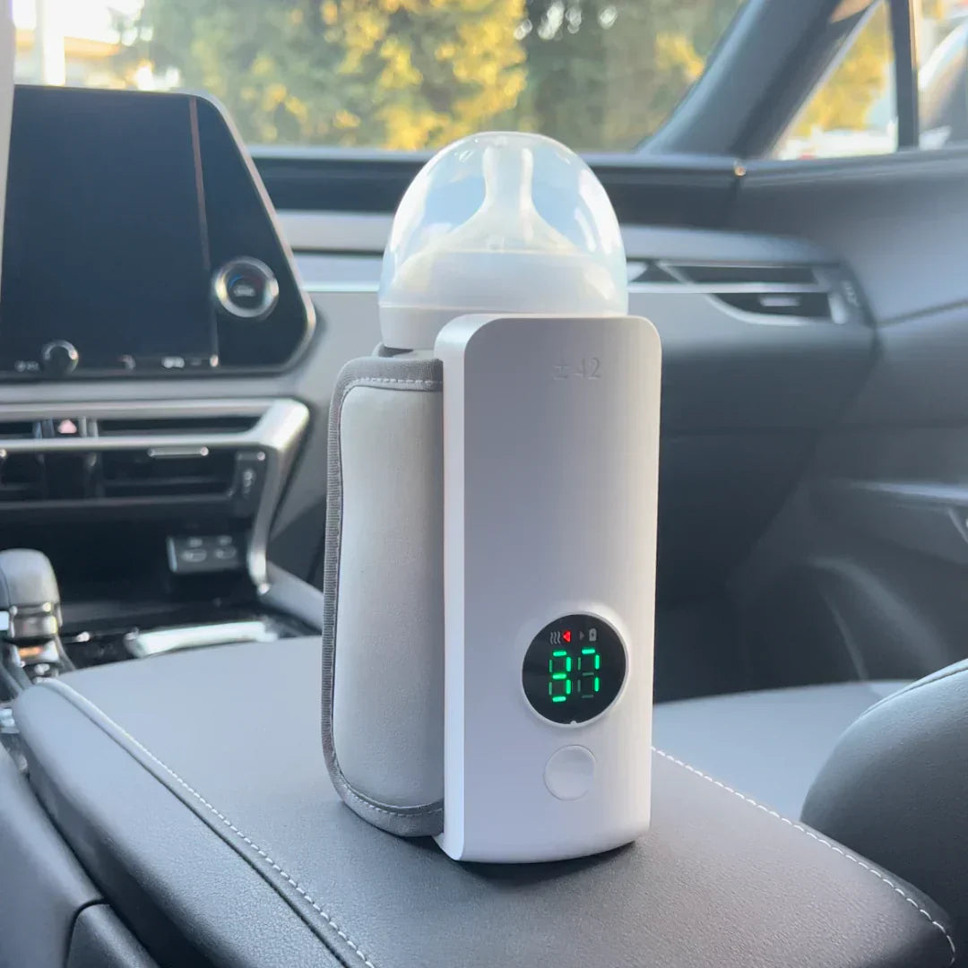 "Portable rechargeable baby bottle warmer with digital display, compact design, BPA-free, USB charging, perfect temperature."