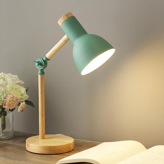 Scandinavian wooden desk lamp with foldable design, colorful shade, adjustable height, and sturdy base. Ideal for any decor.