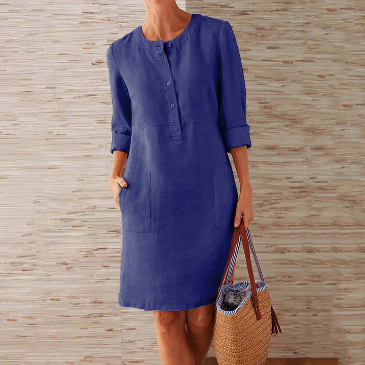 Sky blue women's casual midi dress with long sleeves and side pockets, featuring a round neckline, perfect for everyday wear.