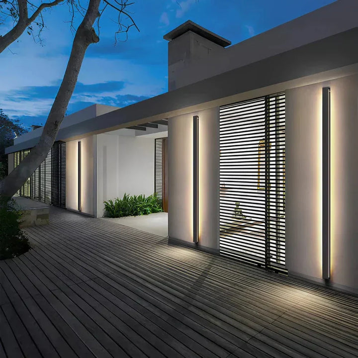 Sleek aluminium outdoor wall sconce with backlit design, ideal for modern patios; corrosion-resistant and stylish.