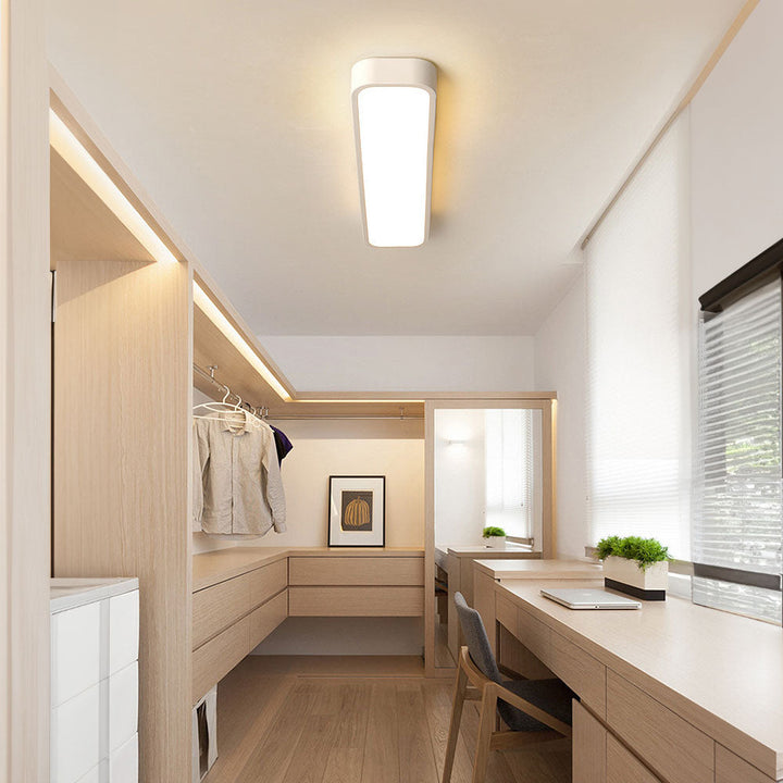 "Sleek minimalist linear LED ceiling light with iron and acrylic design, perfect for modern homes, available in three sizes."