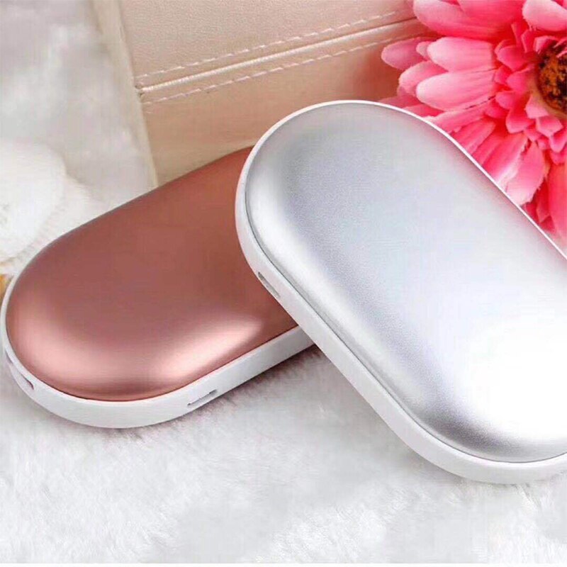 "Sleek silver portable USB hand warmer and powerbank, compact size, double-sided heating, ideal for chilly outdoor use."