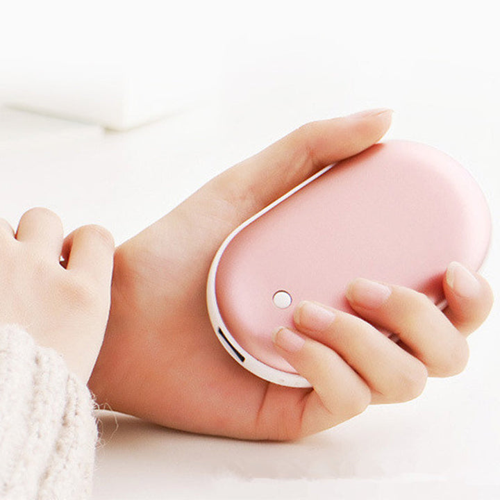 "Sleek silver portable USB hand warmer and powerbank, compact size, double-sided heating, ideal for chilly outdoor use."