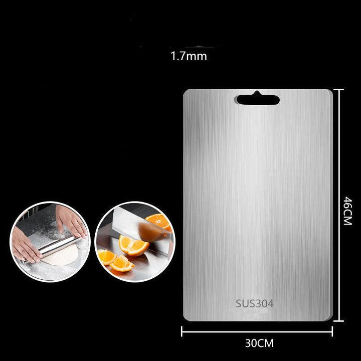 "Sleek stainless steel cutting board in use, showing durability and knife-friendly surface for kitchen prep tasks."