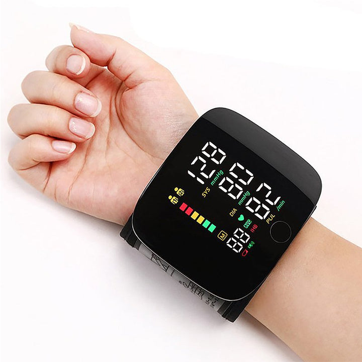 "Smart wrist blood pressure monitor with LCD, voice alerts, compact design, ideal for health & wellness monitoring."