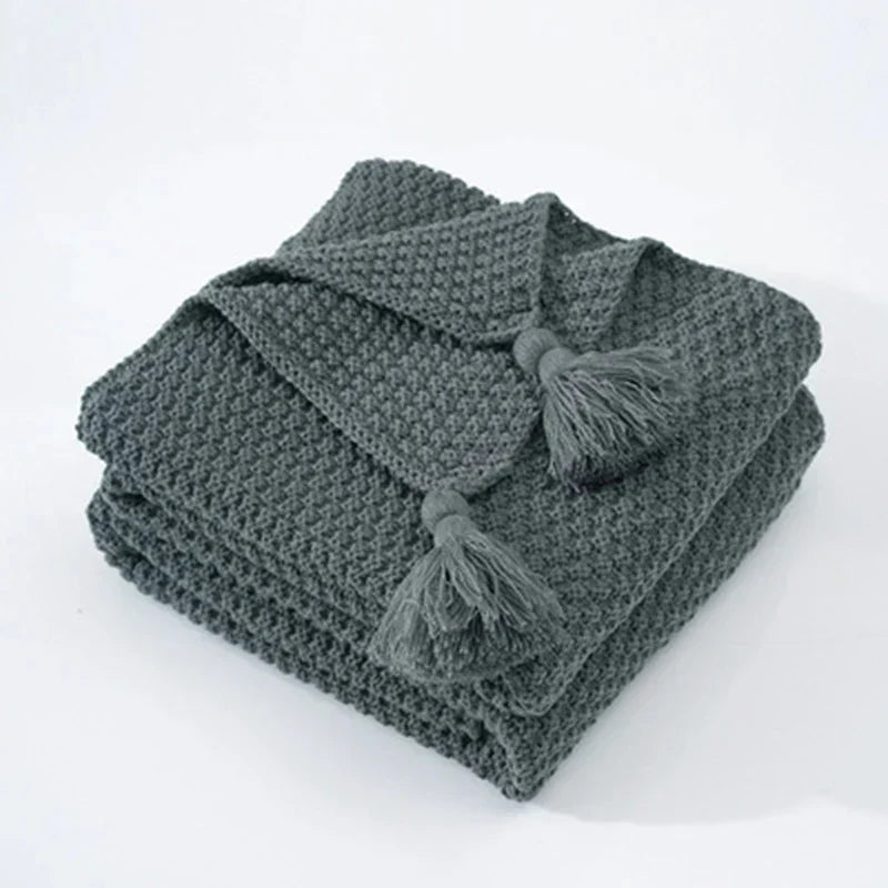 Premium NordicCozy knitted wool blanket, a cozy and warm throw with elegant tassels for ultimate comfort.