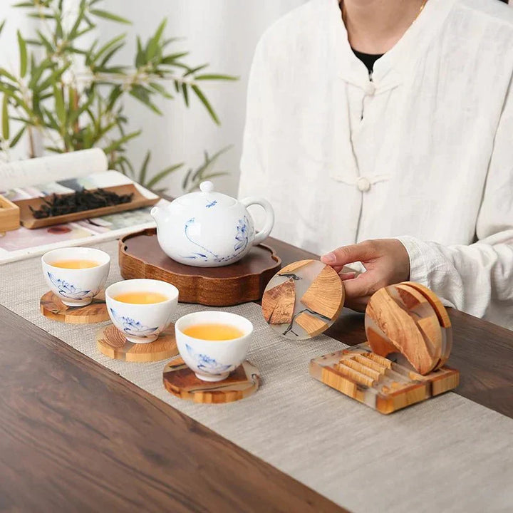 "Solid wood coasters with Japanese design, featuring natural tones and vibrant resin accents, perfect for table protection."