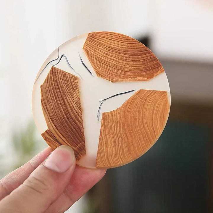 "Solid wood coasters with Japanese design, featuring natural tones and vibrant resin accents, perfect for table protection."