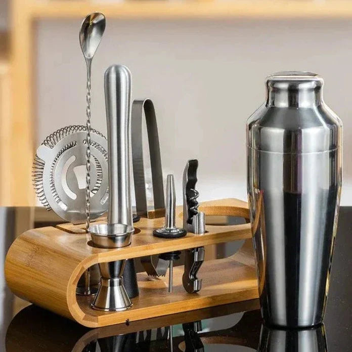 Sophisticated 10-piece stainless steel cocktail set with shaker, jigger, spoon, muddler, pourers, tongs, and storage stand.