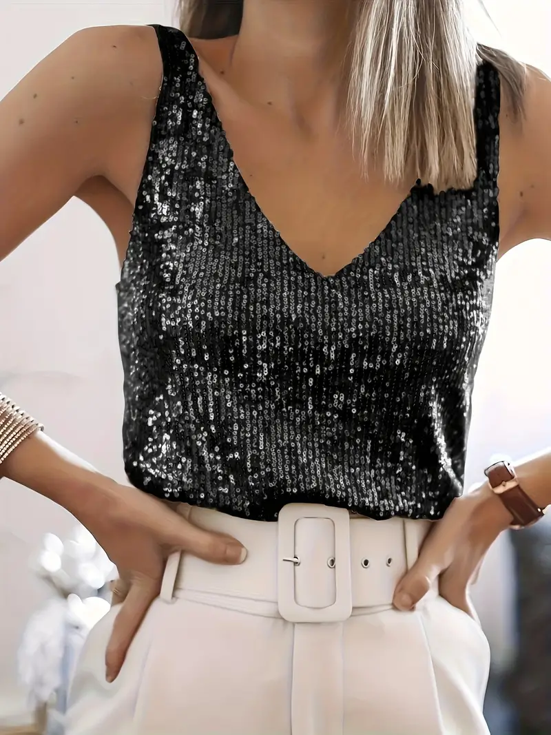 Elegant women's sparkling sequin V-neck sleeveless top. Shimmering party wear blouse for a glamorous look.