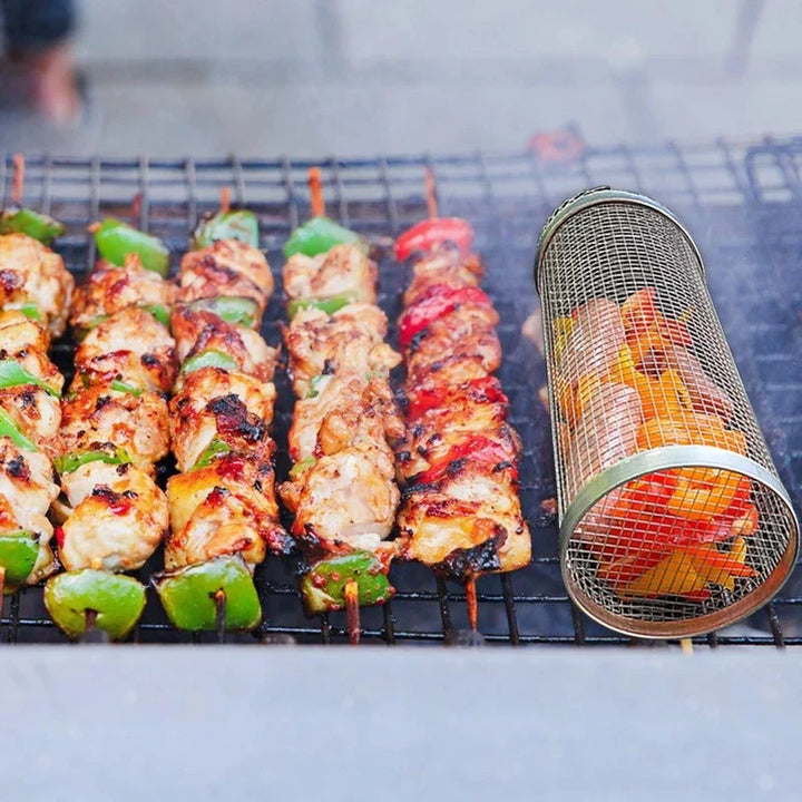 "Stainless steel BBQ rolling basket with mesh design for even grilling, shown with food; essential for outdoor cooking."