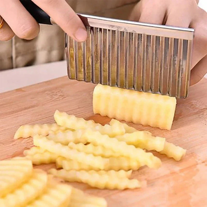 "Stainless steel crinkle cutter knife with a sleek blade, perfect for slicing vegetables and fruits with ergonomic handle."
