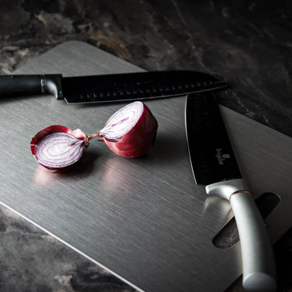 "Stainless steel cutting board, non-slip, scratch-resistant surface for hygienic food prep, sleek design for kitchen use."