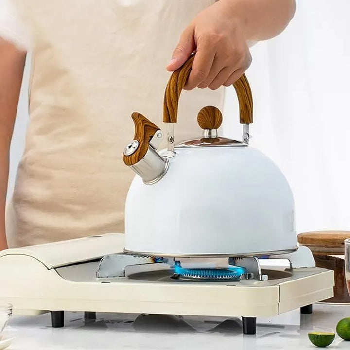 "Stainless steel whistling kettle with insulated handle, sleek design; kitchen essential for all stovetops, 3L capacity."