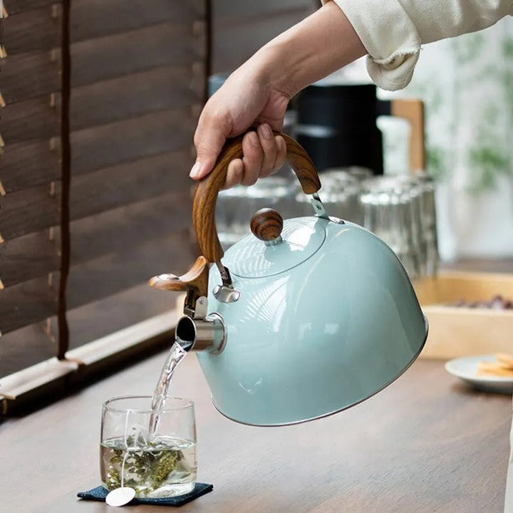 "Stainless steel whistling kettle with insulated handle, sleek design; kitchen essential for all stovetops, 3L capacity."