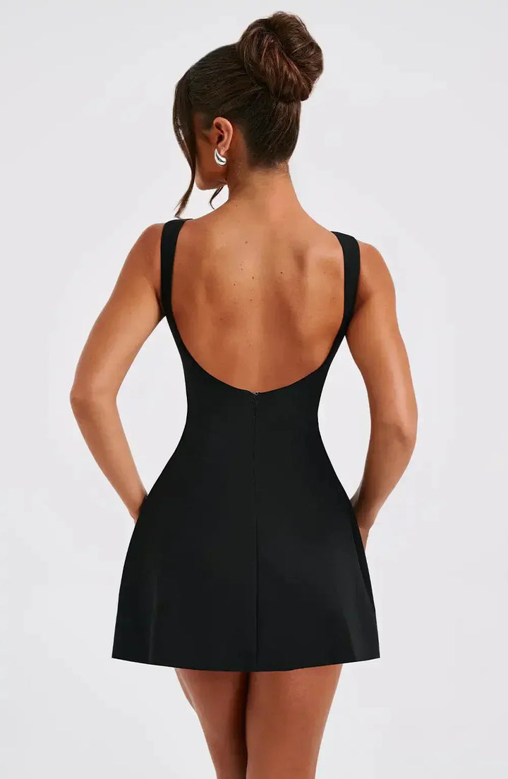 "Stylish black & white women's A-Line boat neck mini dress with elegant sleeveless design, perfect for any occasion."