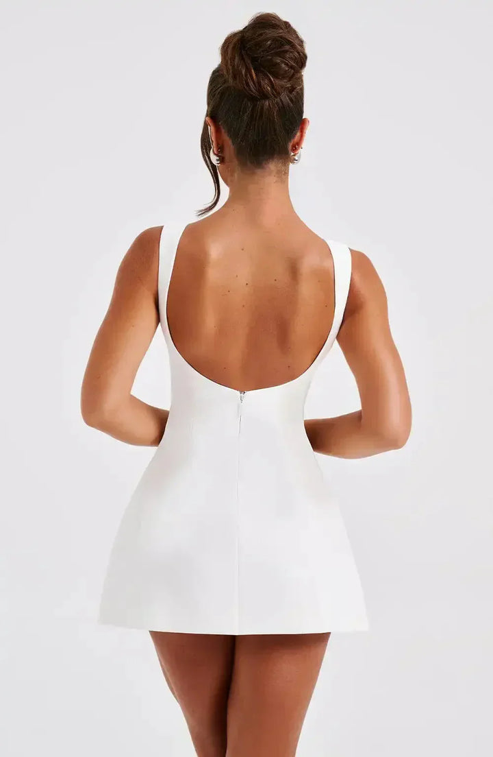 "Stylish black & white women's A-Line boat neck mini dress with elegant sleeveless design, perfect for any occasion."