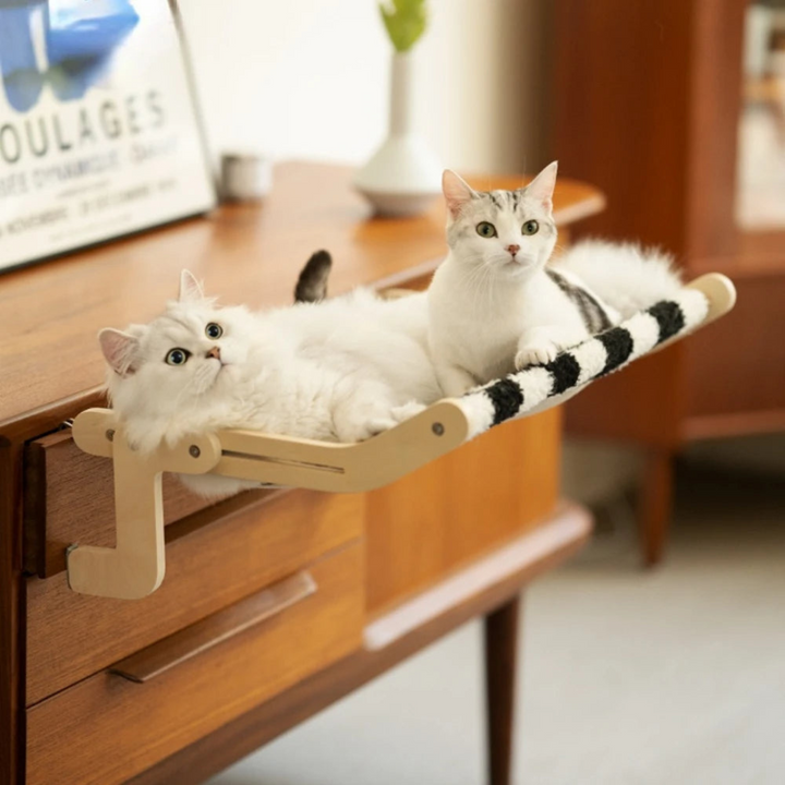 "Stylish space-saving cat hammock in soft fabrics, fits under furniture, available in chic colors, perfect for pet comfort."