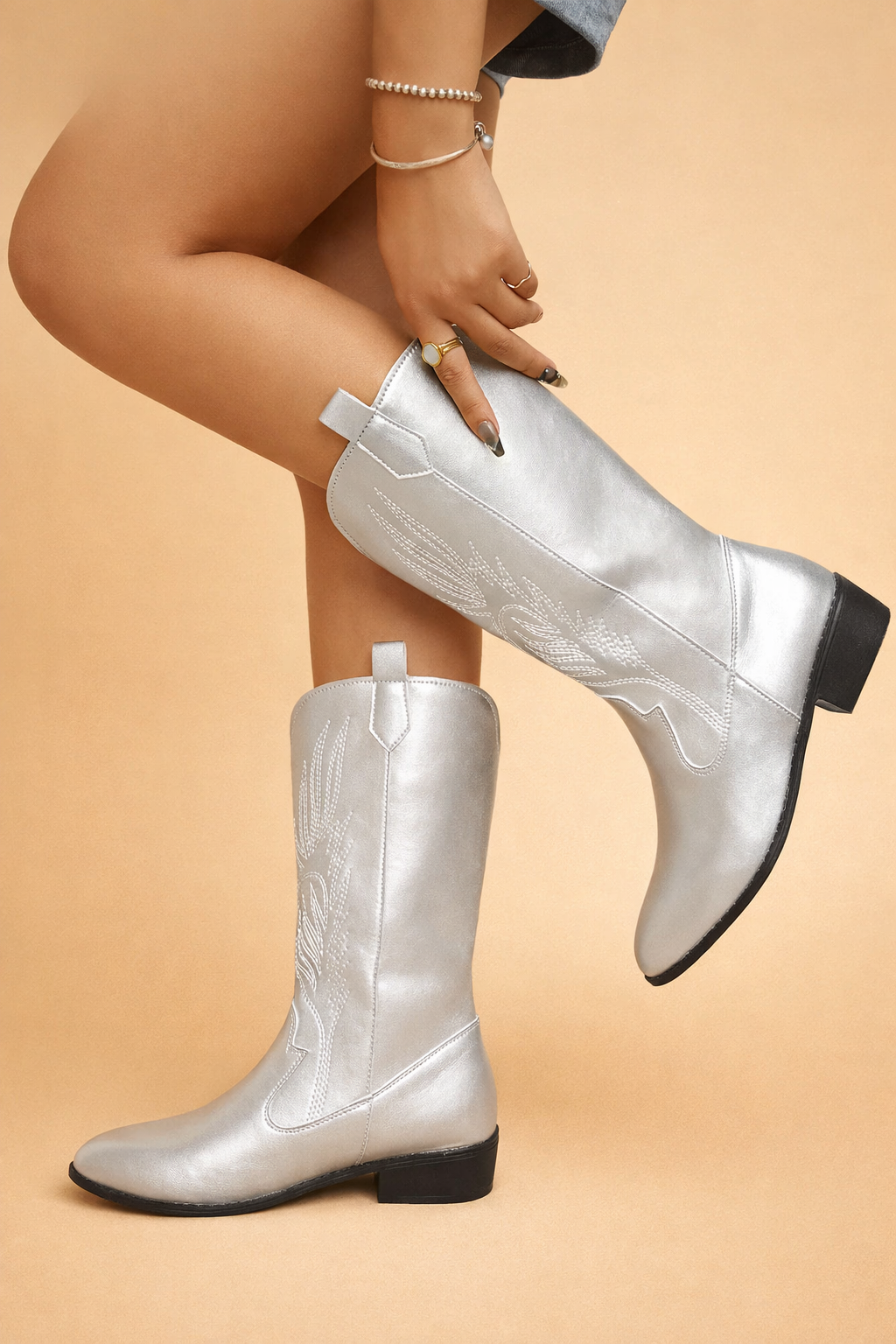 Stylish women's cowboy boots, pointed toe & low heel for comfortable all-day wear. Perfect urban chic fashion.