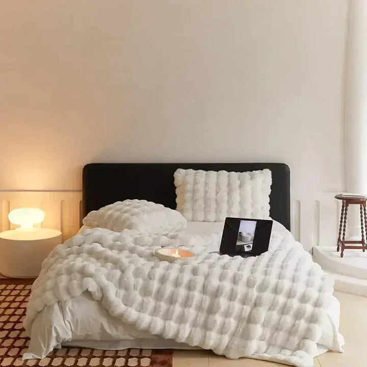 "Ultra-soft faux fur throw blanket, plush texture, beige cream tones, cozy decoration for sofa or bed."