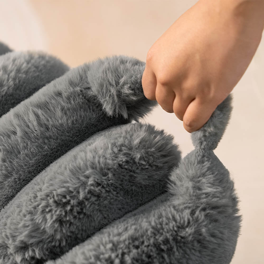 Ultra-soft large plush donut pet bed, creamy faux fur with bolsters for head support, fits humans and dogs, cozy design.