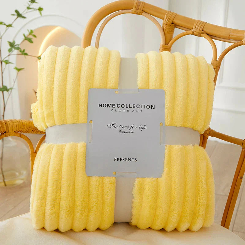 Luxurious striped fleece blanket, perfect for a cozy living room throw.