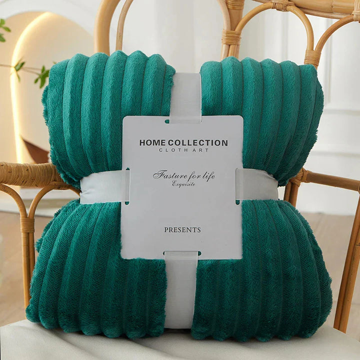 Cozy wide striped flannel fleece throw, enhancing any home decor.