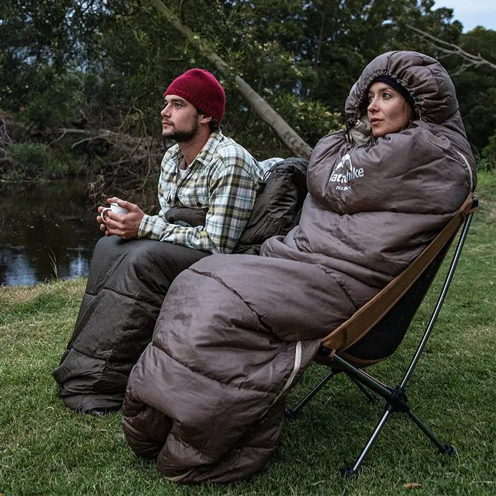Ultralight women's insulated camping sleeping bag; lightweight, compact, blue fabric ideal for cold-weather adventures.