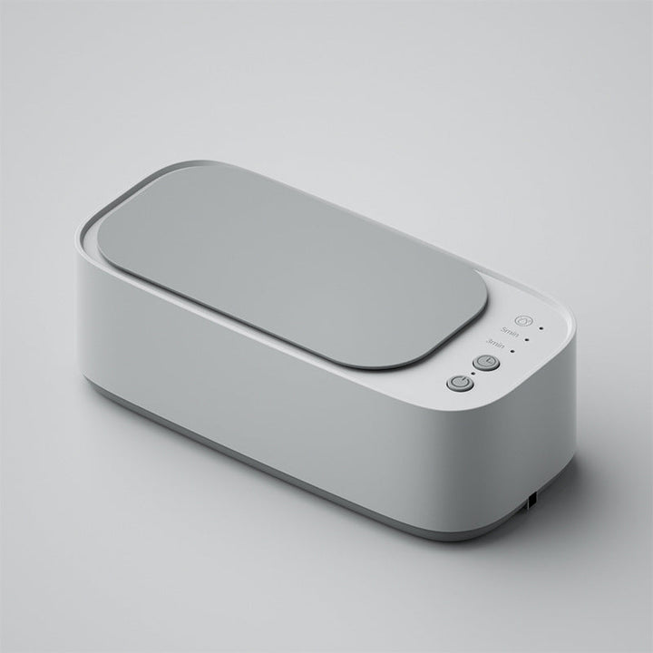 "Ultrasonic cleaning device restoring shine to jewellery, glasses, watches with advanced sound wave technology."