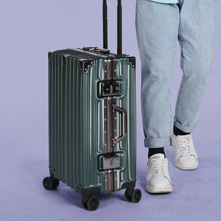 Traveler pulling a unisex aluminum frame hardshell suitcase with smooth spinner wheels.