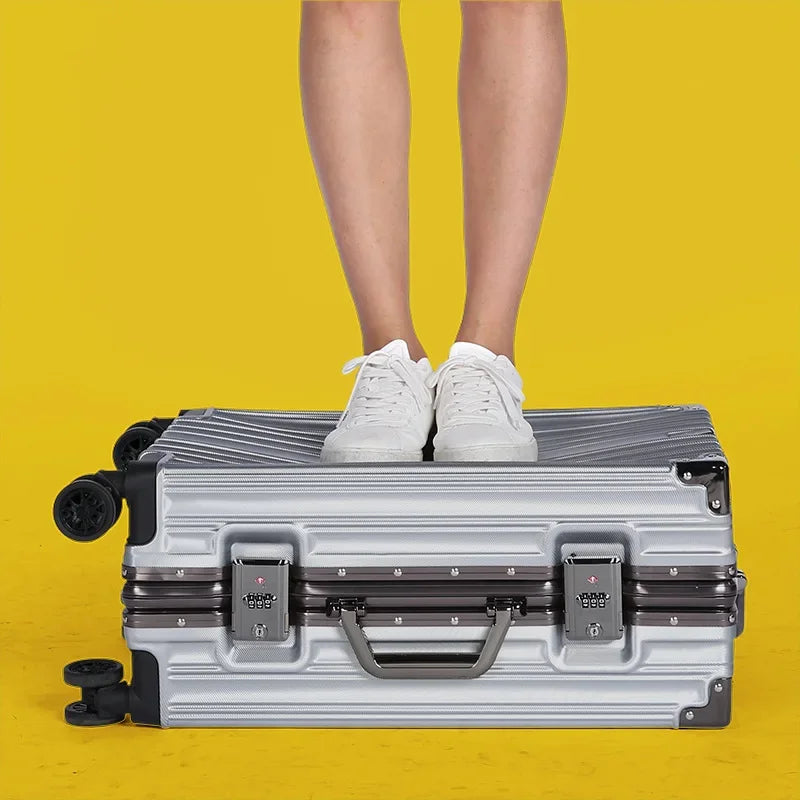 Compact carry-on hardshell suitcase, lightweight with aluminum frame & spinner wheels.