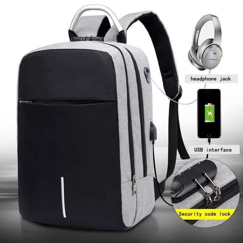 Water-resistant grey anti-theft commuter backpack with integrated USB charging port for laptops.