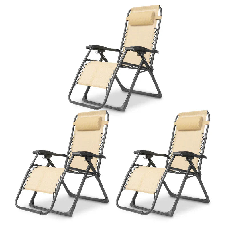 Black zero gravity patio chair, foldable & portable, perfect for backyard relaxation.